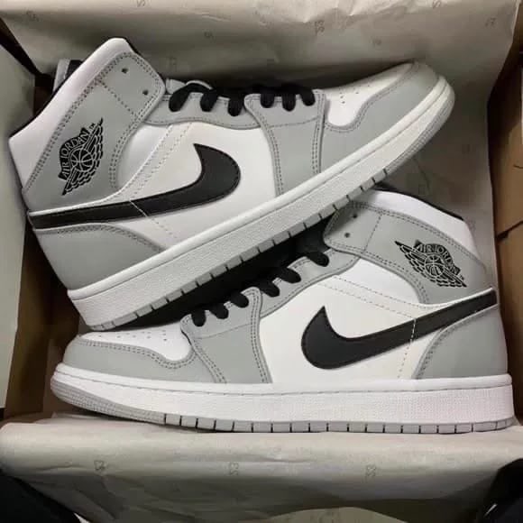 Air Jordan 1 Mid Smoke Grey Jordan sneaker in grey / white / black
